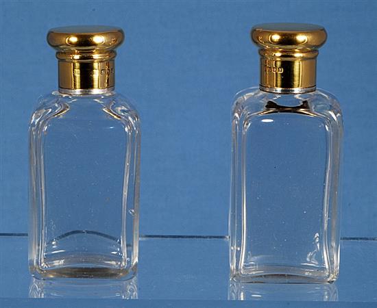 An Edwardian silver mounted glass scent bottle & a pair of scent bottles.